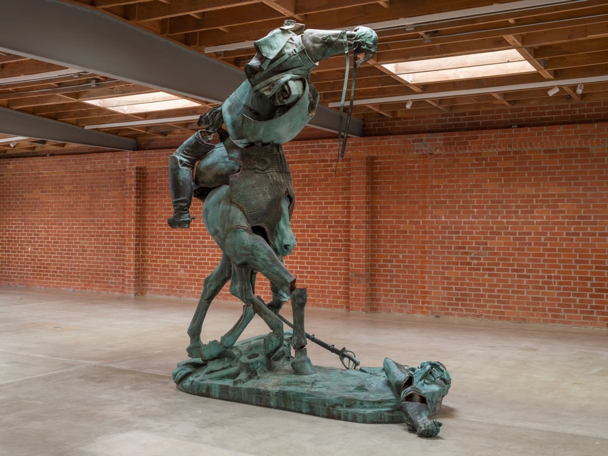 a sculpture of a monstrous figure