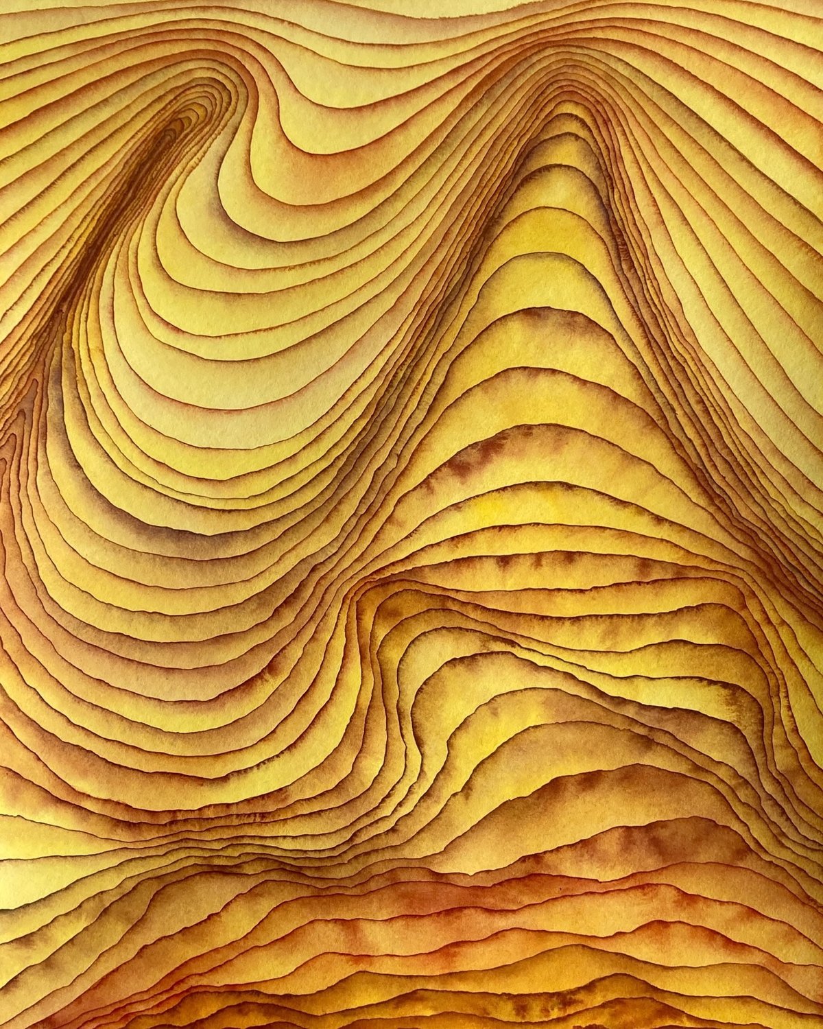 wavy yellow and orange layers that look like sedimentary rocks