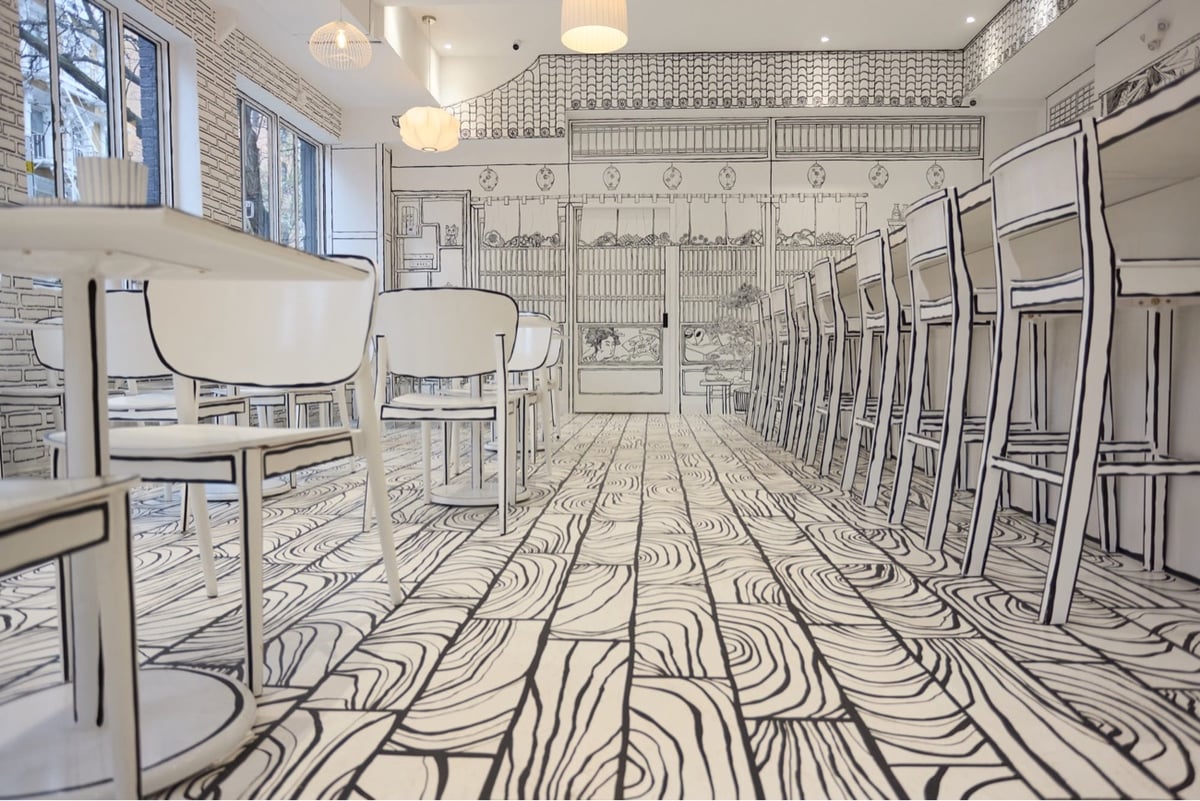 the interior of a restaurant where everything is painted to look like a black & white drawing