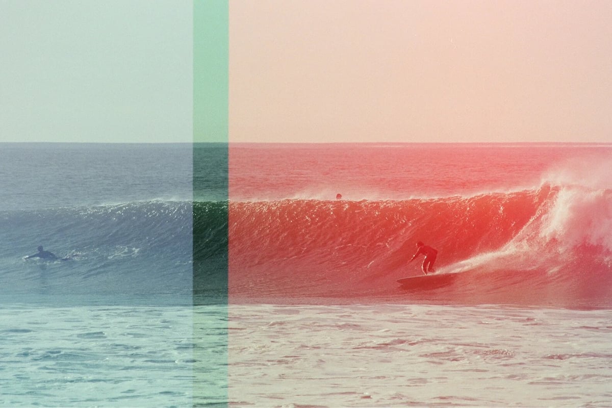 surfer riding a wave, with several bands of different colors overlaid on the image