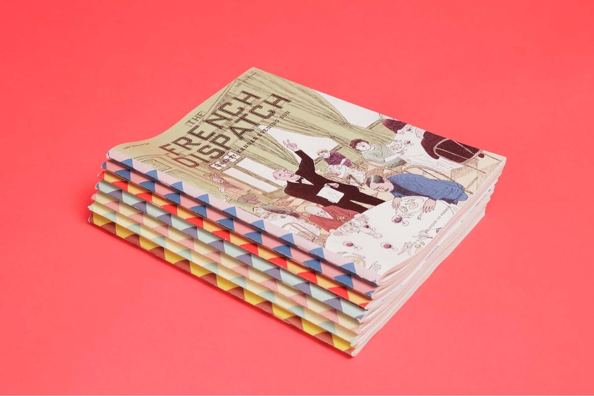 a stack of The French Dispatch magazines