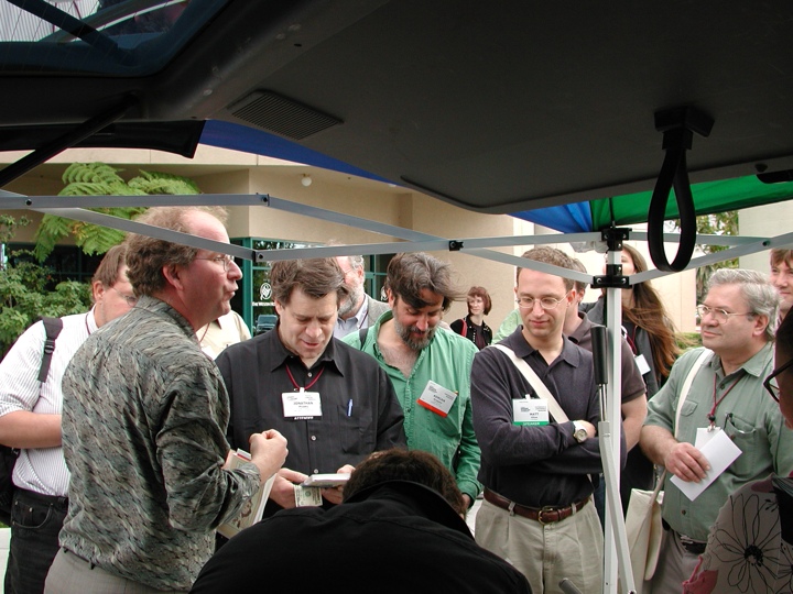 A crowd gathers around the bookmobile