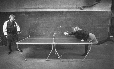 Bill and Hillary Clinton playing ping pong