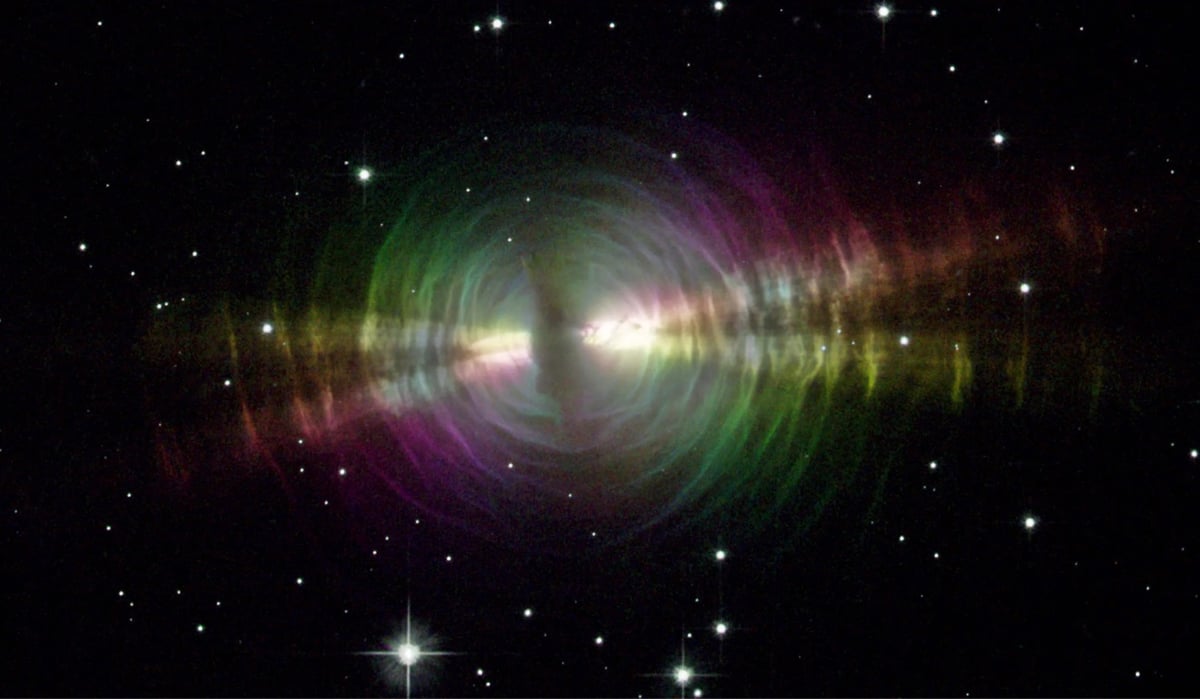 the Egg Nebula as imaged by the Hubble Space Telescope, colorful ripples emanate outward into space