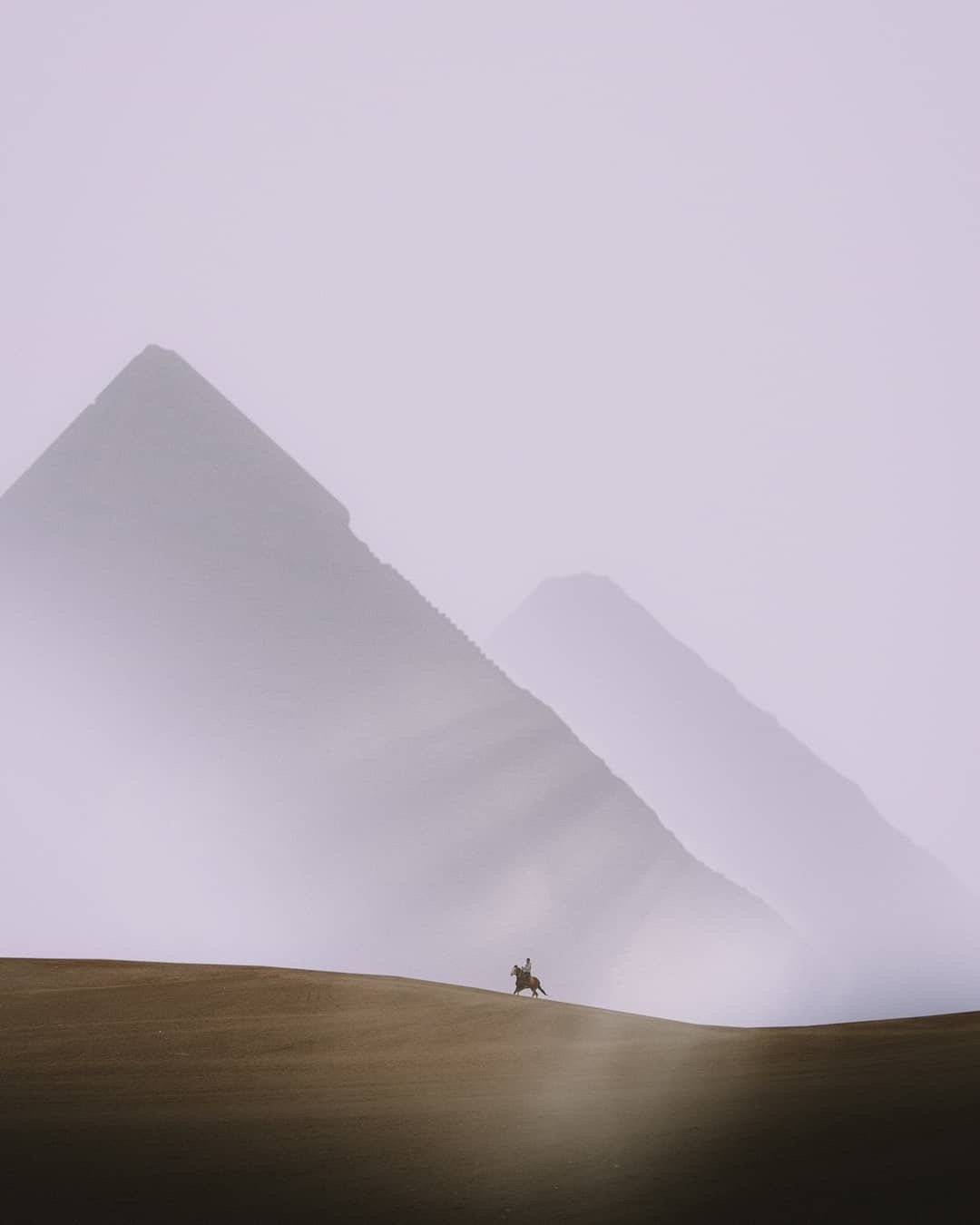 the Pyramids of Giza, shrouded in mist
