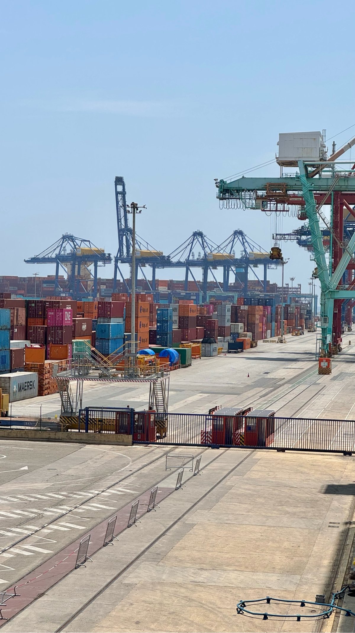 a shipyard filled with shipping containers