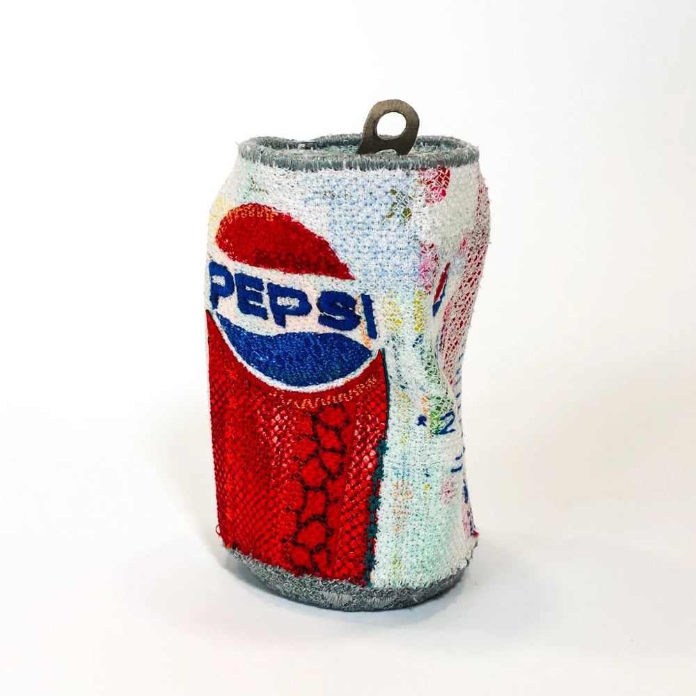 embroidered sculpture of a Pepsi can