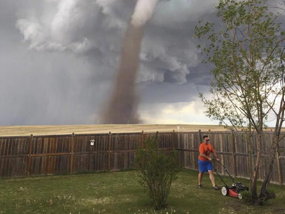 Man Mowing Lawn Tornado