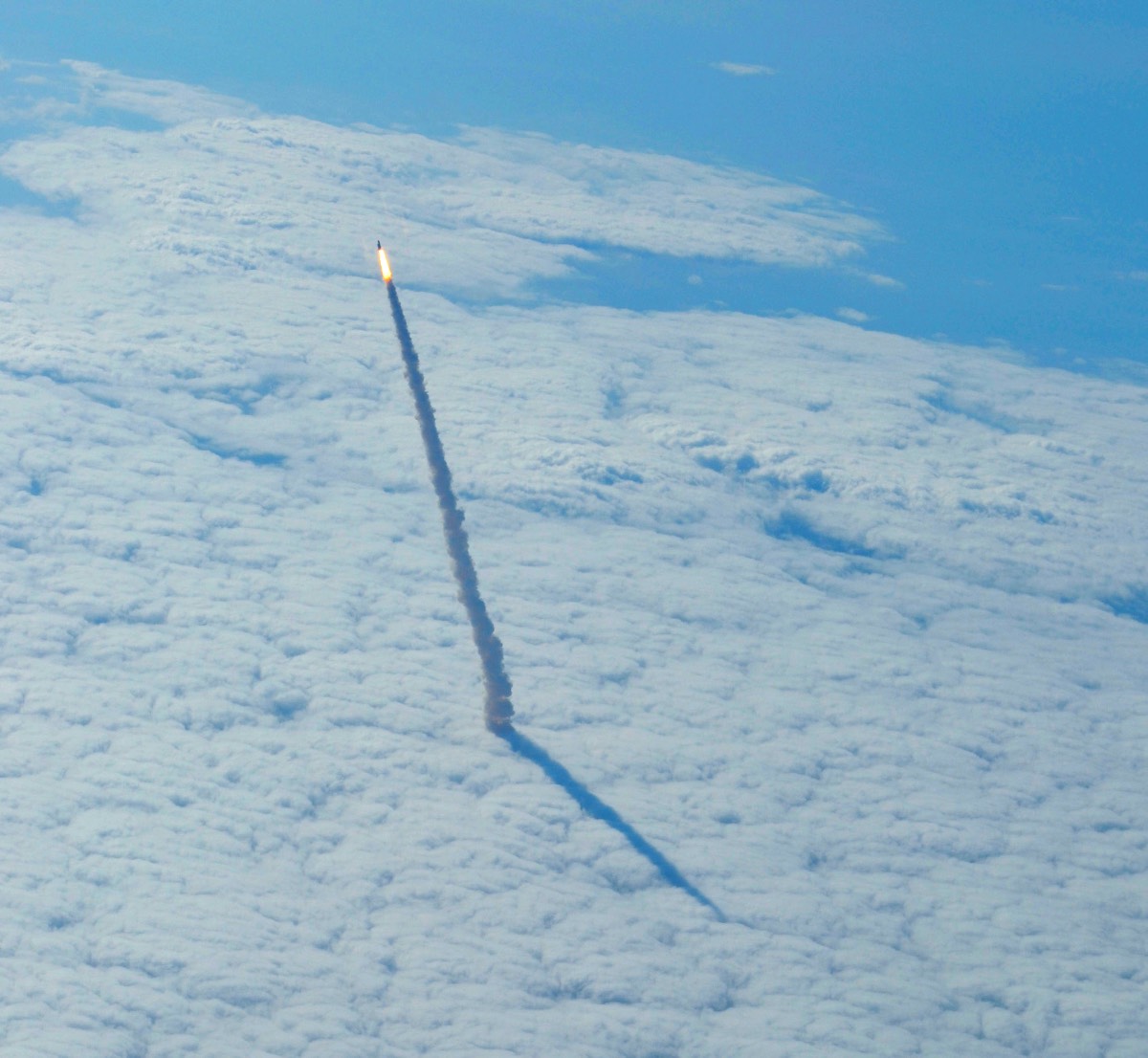 Shuttle Endeavour rising through the clouds