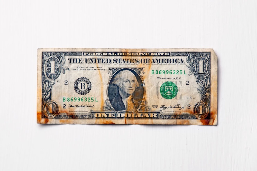a discolored dollar bill found after Hurricane Sandy